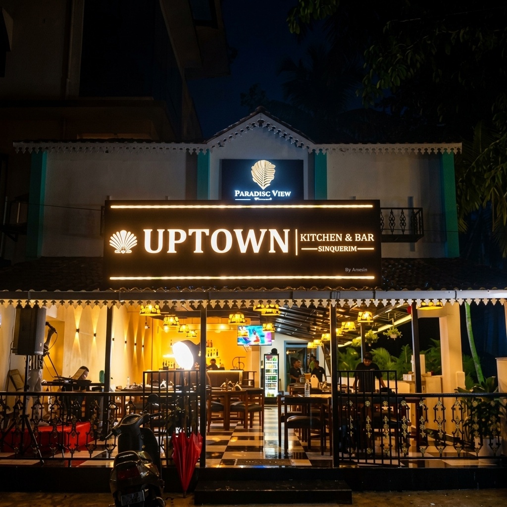 The Sinquerim storefront, lit up after dark